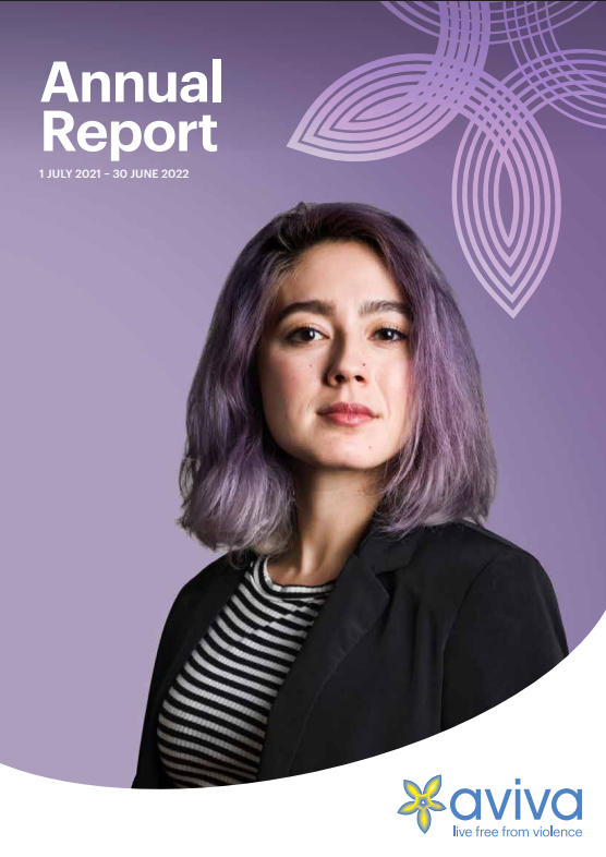 a woman with purple hair looking at the camera