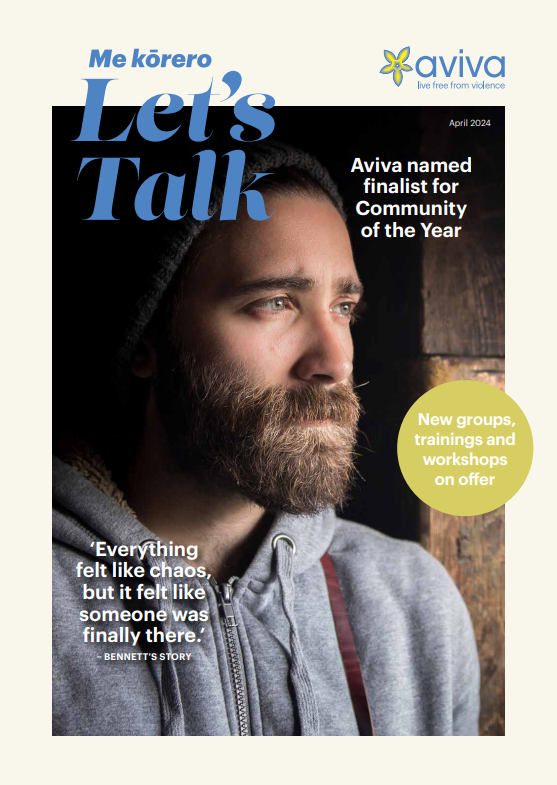 a man in a beanie looks out the window introspectively